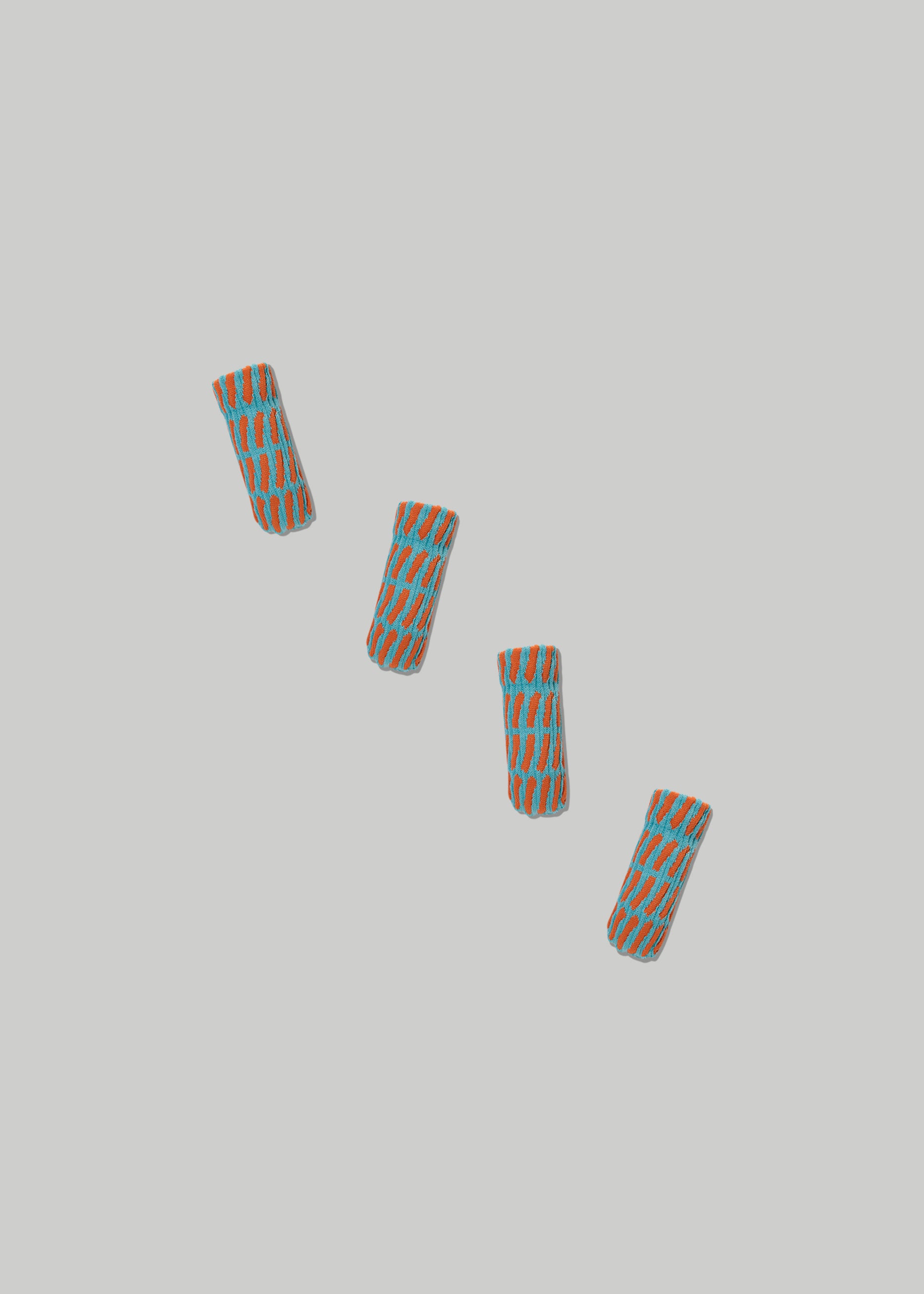 The Warp Chair Leg Cover in Color Cadet Blue and Tangerine