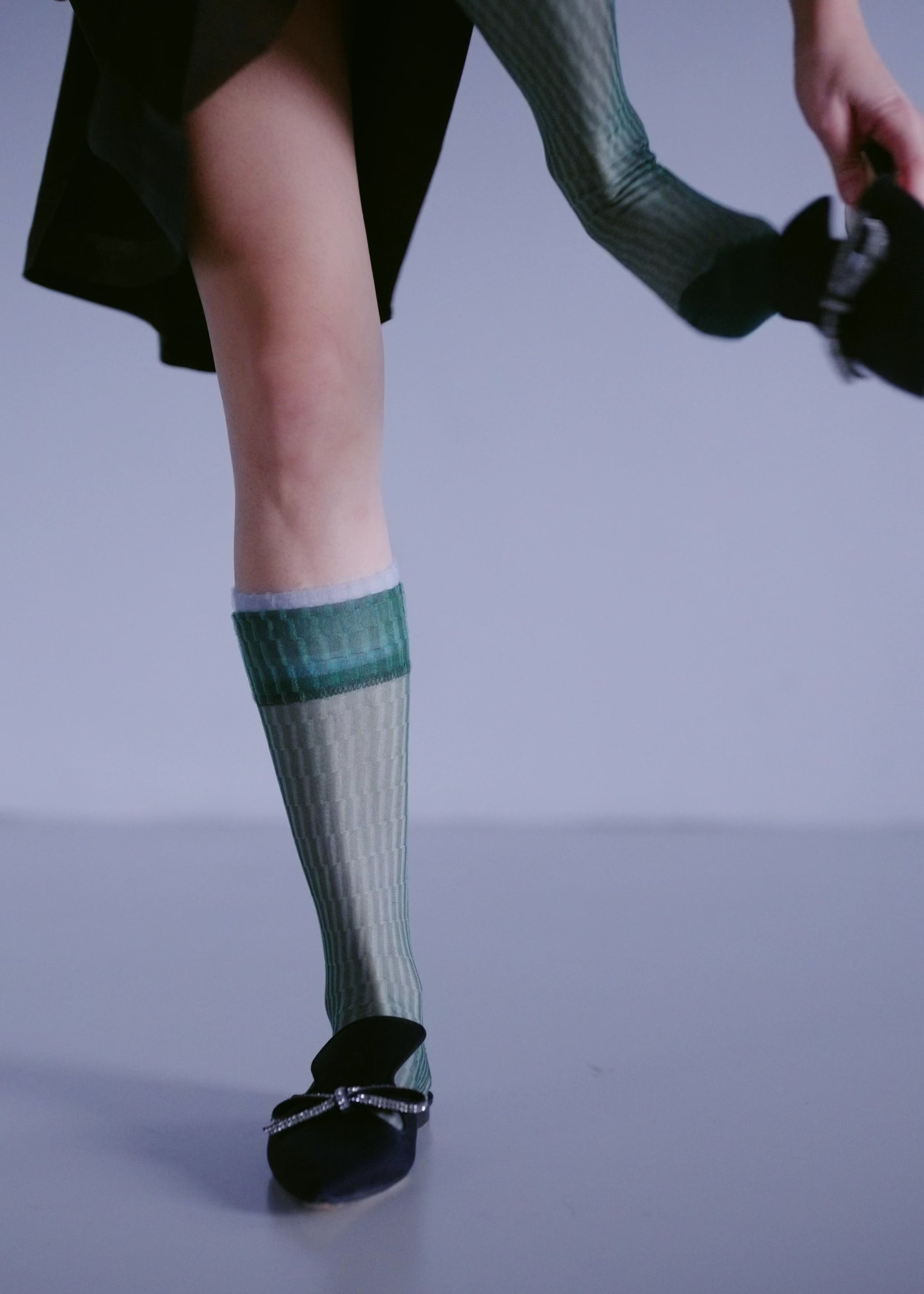 Model Changing and Layering Different Shifting Sheer Socks in a variety of colors